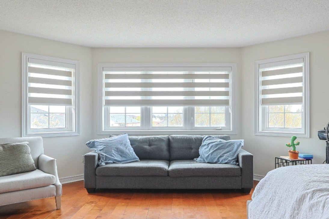 Matching zebra blinds installed across three windows