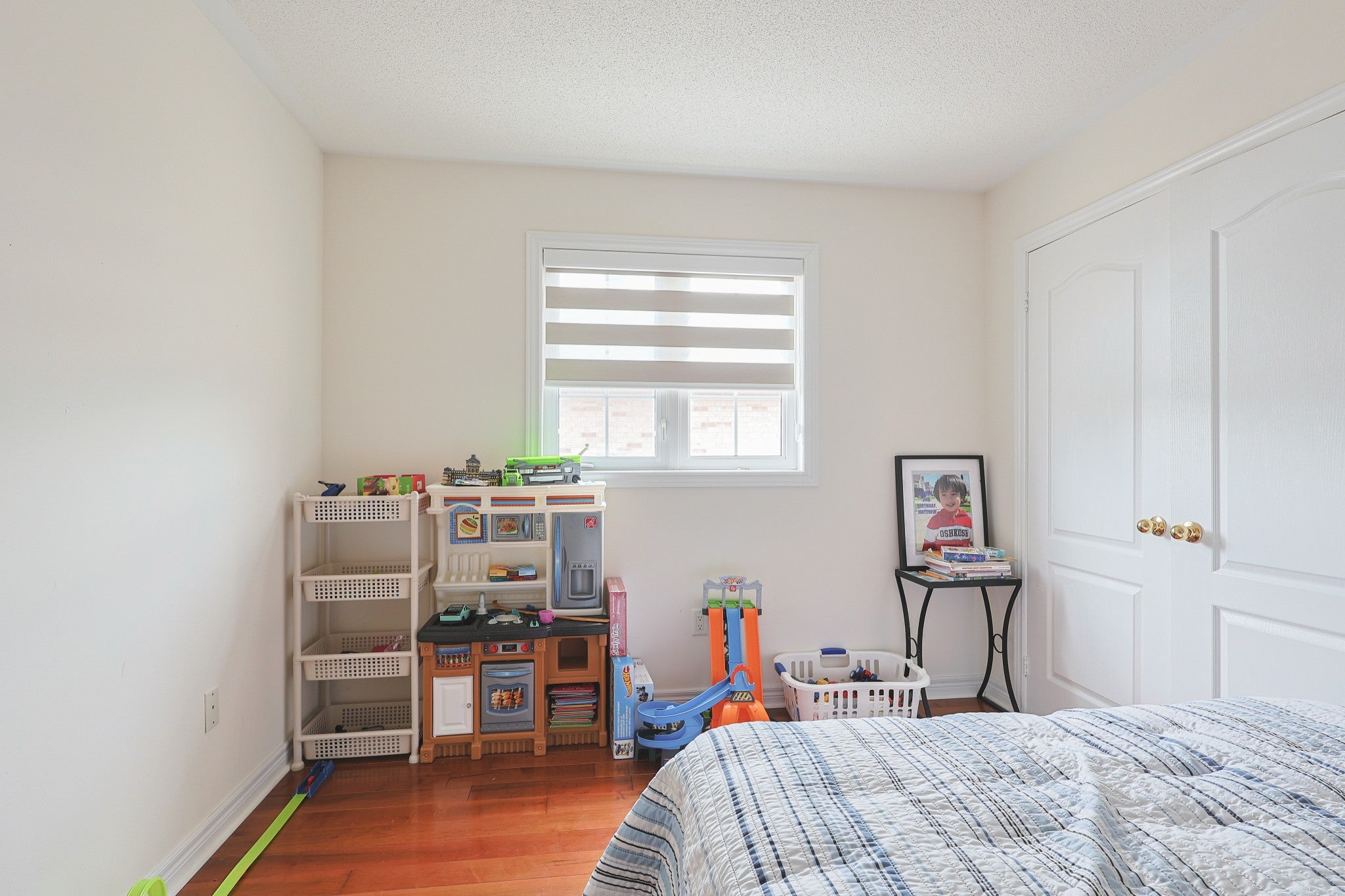 White zebra blind installed in a child’s bedroom