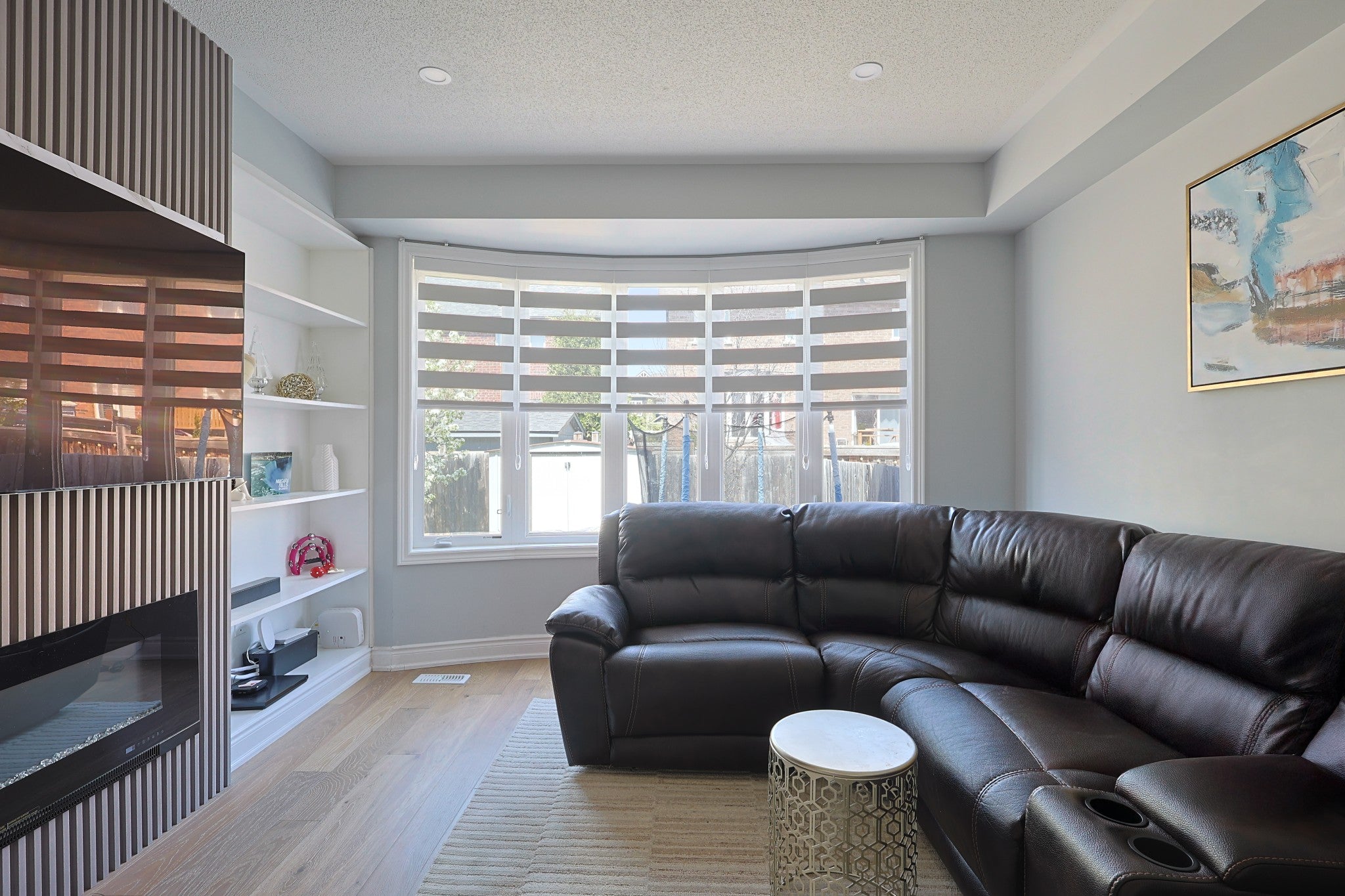 Zebra blinds fitted across living-room bay windows